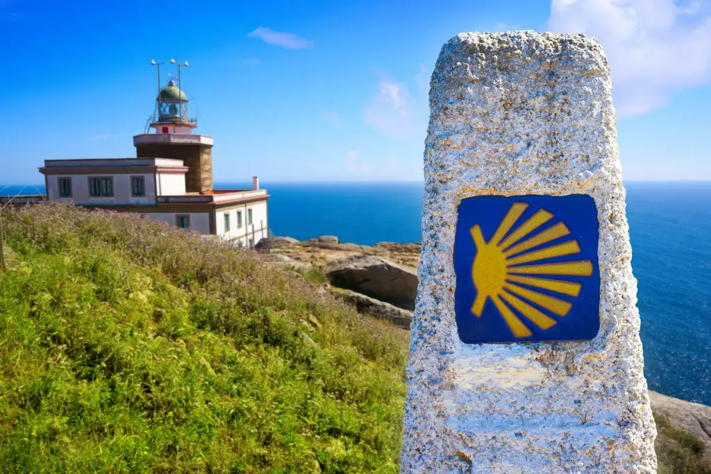 saint-james-way-sign-and-lighthouse-of-finisterre-scaled.webp